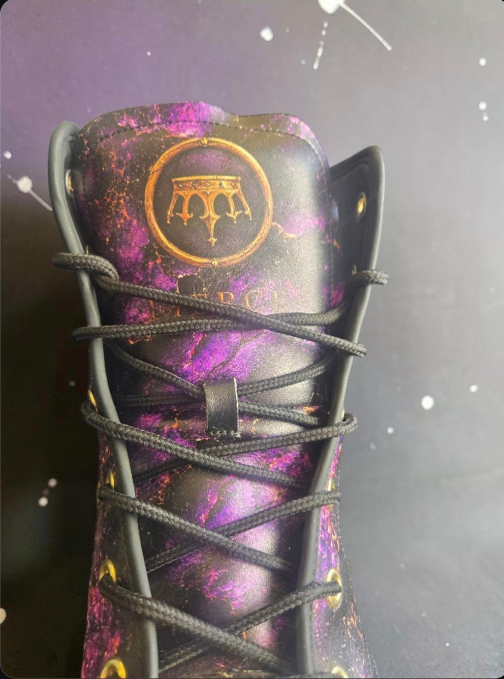 BornFierce Fallen Crown black streetwear boot with purple and gold detailing – fromt view.